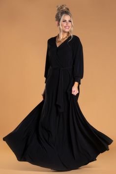 The Wrap Maxi Dress is sophisticated and makes the perfect statement. Featuring a faux wrap, 3/4 length sleeves and waist tie. Made from our favorite wrinkle free fabric, the floor length skirt flows so elegantly. *Runs Large, Size down.* Faux Wrap Waist Tie 3/4 Length Sleeve Wrinkle Free Fabric Machine Washable Delicate or Hand Wash Cold/Hang Dry 95% Polyester 5% Spandex Size and Fit Small: Full Length: 58" Chest: 32" Medium: Full Length: 59" Chest: 34" Large: Full Length: 60" Chest: 36" This d Elegant Long Sleeve Faux Wrap Maxi Dress, Black Long Sleeve Maxi Dress With Tie Waist, Fall Belted V-neck Maxi Dress, Flowy Floor-length Maxi Dress With Draped Sleeves, Luxury Floor-length Maxi Dress With Gathered Sleeves, House Clothes, Floor Length Skirt, Lounge Dress, Maxi Wrap Dress