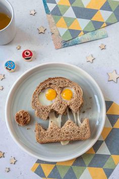 a sandwich with an egg in the shape of a skull on it and some cookies