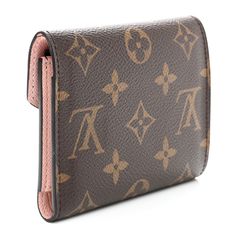 This is an authentic LOUIS VUITTON Monogram Victorine Wallet in Rose Ballerine. This stylish wallet is crafted of traditional Louis Vuitton monogram coated canvas. The wallet features a pink leather snap closure that opens to a pink crossgrain leather interior with card slots, patch pockets, a bill compartment, and a zipper pocket. Pink Leather, Leather Interior, Authentic Louis Vuitton, Snap Closure, Louis Vuitton Monogram, Patch Pocket, Card Slots, Zipper Pocket, Slots