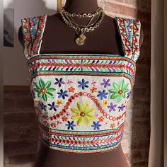 New! Alice + Olivia Boho White Colorful Floral Embroidery 100% Linen Crop Top Size 6 Fitted Multicolor Embroidered Choli, Fitted Choli With Multicolor Floral Embroidery, Multicolor Floral Embroidered Top For Navratri, Navratri Floral Embroidered Multicolor Top, Navratri Multicolor Floral Embroidered Top, Festive Multicolor Embroidered Fitted Top, Spring Sleeveless Embroidered Choli, Sleeveless Embroidered Choli For Spring, Festival Embroidered Multicolor Top