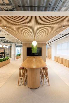 an empty conference room with wooden tables and chairs