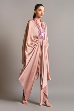 Blush pink draped cape with asymmetric hem and metallic polymer trims.
Component: 1
Embroidered
Neckline: V Neck
Fabric:  Chiffon
Color: Pink
Asymmetric hem
Draped cape
Note: Pant worn by the model is not for sale - Aza Fashions Cowl Dresses, Prathyusha Garimella, Bubu Dress, Amit Aggarwal, Coordinate Sets, Cape For Women, Accounting Principles, Kurta Sharara, Eid Outfits