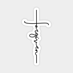 a sticker with the word jesus written in cursive writing and a cross on it