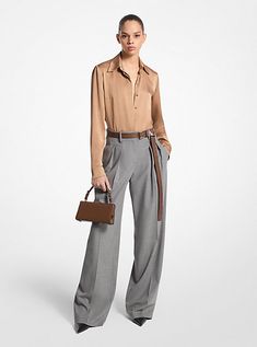 These wide-leg trousers combine timeless tailoring elements, like front pleats and crisp leg creases, with stretch-infused virgin wool sourced from an Italian mill. A high-rise fit evokes a strong feminine aesthetic. Balance its soft hand and languid drape with pointed-toe heels. Made in Italy. Luxury Wide Leg Pants For Fall, Fall Business Wide Leg Pants With Pressed Crease, Luxury Tailored Wide Leg Pants For Fall, Luxury Tailored Wide Leg Pants For Business Casual, Luxury Wide Leg Pants For Business Casual, Luxury Tailored Wide Leg Pants For Workwear, Luxury Wide Leg Pants For Office In Fall, Luxury Tailored Wide Leg Pants For Office, Luxury Wide Leg Pants With Belt Loops For Work