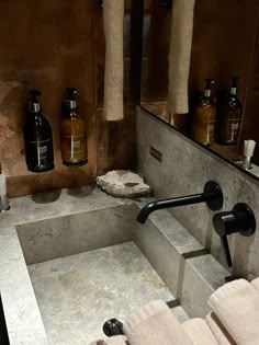 a bathroom sink with soap and lotion in it