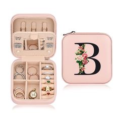 an open pink case with jewelry inside