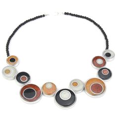 a necklace that has different colored circles on it