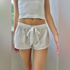 Nwt Brandy Melville Soft Cotton Pajama Shorts With Two Button Details, An Elastic Waistband, And Silk Drawstring. Says It Is A Size S/M On The Website, But Fits More Like A Small And Is Low Rise. So Comfy And Cozy! White Sleepwear With Built-in Shorts, Summer Sleepwear With Elastic Waistband, Summer Pajama Shorts With Elastic Waistband For Pajama Party, Relaxed Fit Pajama Shorts For Summer Bedtime, Short Length Sleepwear With Elastic Waistband For Summer, Casual Pajama Shorts With Elastic Waistband For Pajama Party, Casual Pajama Shorts With Elastic Waistband For Daywear, Cotton Shorts With Elastic Waistband For Pajama Party, Summer Bottoms With Elastic Waistband For Sleepovers