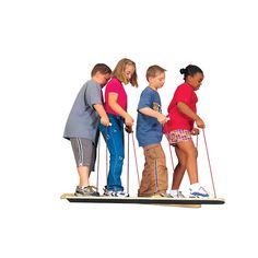 four children are standing on skis with poles attached to their feet and one child is holding the pole