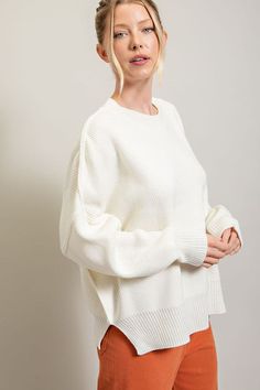 Snuggle up in our Long Sleeve Ribbed Sweater for unbeatable comfort and flattering style. This pullover is knit with solid ribbed fabric giving it a roomy, laid-back fit that's great for everyday wear. Along with accent seams and a round neckline, you have two side slits for added movement. Cozy and stylish - the perfect combo!Model is 5'8" and is wearing a small. Size Measurement (inch): SM: 30.5 (Bust), null (Waist), null (Hips), 25.5 (Length) ML: 31.0 (Bust), null (Waist), null (Hips), 26.0 (Length) Snug Sweater With Ribbed Cuffs For Loungewear, Snug Solid Sweater For Loungewear, Comfy Textured Knit Sweater For Loungewear, Comfortable Ribbed Sweater For Loungewear, Winter White Relaxed Fit Soft Knit Sweater, Solid Color Relaxed Fit Knit Sweater, Relaxed Fit Solid Knit Sweater, Solid Color Knit Sweater With Relaxed Fit, Comfy Ribbed Loungewear Sweater