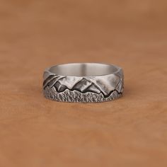 Handmade Silver Mountains and Sky Statement Band Ring, Brutalist Jewelry, Stackable Oxidized Biker Rings for them, Avant Garde Jewelry Gifts Made of 925 silver and handcrafted by hand, this ring is not only an accessory piece that complements your daily elegance, but also has details that will reflect your character and style. It is also a great gift to give to your loved ones on their special days. At SavisSilver, we always give importance to the satisfaction of our customers, we recommend you Durable Silver Promise Ring, Durable Silver Jewelry Gift, Durable Silver Metal Ring, Vintage Silver Jewelry For Outdoor, Round Durable Jewelry For Gifts, Rustic Ring Jewelry Gift, Handmade Vintage Stainless Steel Rings, Mountains And Sky, Brutalist Jewelry