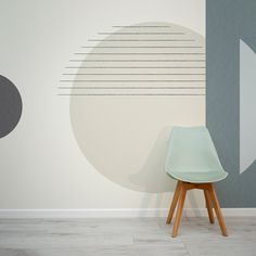 a chair sitting in front of a wall with circles on it and lines painted on the wall