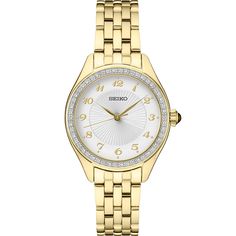 This women's timepiece has a quartz movement and has a round 29MM case. The case and bracelet have a yellow gold-tone and the dial is silver. The bezel is set with Swarovski crystals. Anniversary Diamond Watch With Chronograph And Round Dial, Timeless Diamond Watch With Metal Dial For Anniversary, Classic Round Diamond Analog Watch, Classic Analog Diamond Watch, Timeless Diamond Watch For Anniversary, Anniversary Diamond Watch With Metal Dial, Classic Gold Diamond Watch With Chronograph, Classic Diamond Chronograph Watch For Anniversary, Yellow Gold Diamond Watch With Metal Dial For Formal