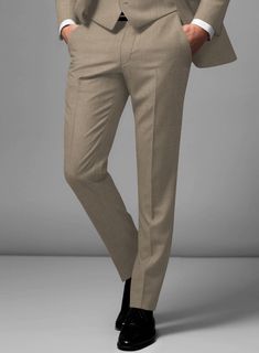 Revive decades of standout looks with our Scabal Boston Khaki Wool Pants. Crafted from pure wool, the khaki color of these pants is highly versatile and can make a surprisingly stylish alternative to traditional pants. They create a flawless ensemble for special events and formal occasions. Simply team them up with a matching waistcoat and jacket, a white formal shirt, a maroon tie, and polished black shoes to complete the look.  Look Includes  Scabal Boston Khaki Wool Fabric  Cross Pocket  Flat Front  Two Welted Back Pockets on Trousers   You can change the look during customization if required.  Lining: Viscose, Dry Clean. Traditional Pants, Maroon Tie, Grey Tweed Suit, Herringbone Tweed Jacket, White Linen Suit, Green Velvet Jacket, Peaky Blinders Suit, Royal Blue Suit, Fabric Cross