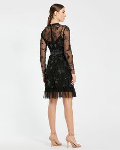 This exquisite dress features delicate sheer long sleeves that add a touch of allure, while intricate embellishments create a captivating sparkle. The flattering midi length makes it perfect for cocktail parties, formal events, or special occasions. Mac Duggal Embellished mesh overlay; 100% polyester lining Fully-lined bodice; sheer sleeves High neckline Long sleeve Floral embellishments with beaded detailing Ruffled/detailed hem Approx. 40" from top of shoulder to bottom hem Available in Black Vestidos Color Coral, Mac Duggal Dress, Embellished Midi Dress, Sheer Long Sleeve, Cocktail Parties, Mesh Overlay, Mac Duggal, Tea Length Dresses, Embellished Dress