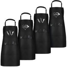 three black aprons with different designs on them