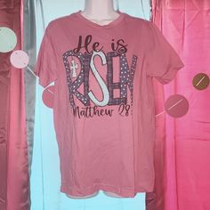 This Is Brand New Easter T-Shirt It Says He Is Risen With A Cross On It It's On A Hot Pink Shirt It's A Size Medium For Women Or Juniors It's So Cute You Could Wear This The Whole Month Of March Comes From A Pet And Smoke Free Home Will Ship Out In One To Two Business Days Unless A Weekends Pink Shirt With Text Print For Spring, Spring Pink Shirt With Text Print, Employee Uniform, Hot Pink Shirt, Month Of March, Easter T Shirts, He Is Risen, Tie Dye T Shirts, Knitted Tshirt