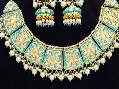 Free Fast Shipping to USA and UK Metal = Gold Plated Occasion = Wedding ,Party Wear, Bridal Color = Turquoise/Firoza and White Size = Necklace Length = 7 Inches Long, Earring Size = 3.5 Inches Long, Necklace Weight = 118 grams Earrings Weight = 24 grams Happy Buying :) Traditional Turquoise Jewelry With Latkans, Festive Turquoise Kundan Necklace In Temple Jewelry Style, Festive Turquoise Kundan Necklace For Wedding, Turquoise Kundan Necklace With Meenakari For Wedding, Traditional Turquoise Kundan Necklace For Festive Occasions, Traditional Turquoise Jewelry Sets For Festive Occasions, Bollywood Style Turquoise Jewelry With Latkans, Traditional Turquoise Kundan Necklace, Turquoise Meenakari Necklace For Wedding