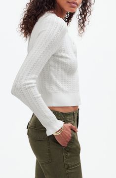 This cozy button-front cardigan comes in Madewell's soft, lacy semi-open Signature Knit. With a flattering slim fit, it has ruffled cuffs that add a playful finishing touch. 20 1/2" length Front button closure Crewneck Long sleeves 72% Lenzing™ EcoVero™ viscose, 28% polyester Lenzing EcoVero viscose is a more-sustainably produced fiber made using pulp made from renewable wood sources Machine wash, tumble dry Imported Feminine Fitted Cardigan For Daywear, Fitted Pointelle Knit Cardigan For Daywear, Chic Button-up Cardigan In Pointelle Knit, Chic Button-up Pointelle Knit Cardigan, Chic Button-up Cardigan With Pointelle Knit, Feminine Fitted Cardigan For Layering, Fitted Pointelle Knit Cardigan For Spring, Fitted Pointelle Knit Cardigan For Fall, Feminine Fitted Open Knit Sweater