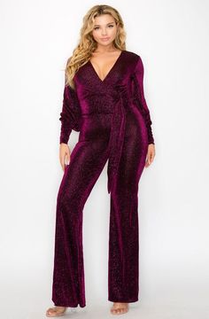 This Plus Size Glitter Fabric Bishop Sleeve Belted Jumpsuit exudes exclusivity and sophistication. Crafted from a high-quality, glitter fabric, this jumpsuit is tailored with bishop sleeves and an adjustable belt to flatter your shape. Perfect for a night out that will have you standing out from the crowd. -GLITTER FABRIC -V NECKLINE -BISHOP SLEEVE -BELTED (SASH) -WIDE LEG -STRETCH -MODEL IS 5'8" AND WEARING A 1X Fabric Contents POLYESTER 95% / SPANDEX 5% Belt Jumpsuit, Skincare Blog, Leg Stretching, Bishop Sleeve, Glitter Fabric, Adjustable Belt, Handbags For Men, Plus Size Tops, Men Dress