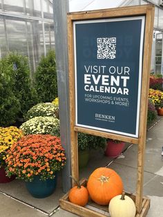 several pumpkins are sitting in front of a sign that says visit our event calendar