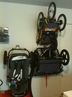 two bikes are stacked on top of each other in a room with an overhead bike rack