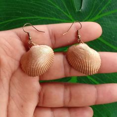 Bronze painted seashell earrings. From start to finish and glossed for protection. Pieces of jewelry created and well crafted for you to wear anywhere and everywhere!! I really like putting effort into these cause they come out looking so nice and shiny. I used gold stainless steel earring hooks so they would match the color just right. :) Handmade Shell Earrings For Beach Season, Beachy Shell Dangle Earrings, Shell Drop Earrings For The Beach, Shell Earrings For Beach Season Gift, Beach Season Shell Earrings Gift, Beach Season Gift Shell Earrings, Shell-shaped Earrings For Beach Season Gift, Shell-shaped Earrings For Beach Season, Shell Earrings For Beach Season