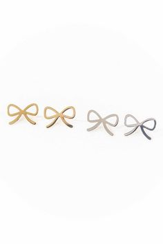 Cute bow charm earrings in gold.Stainless Steel14k Gold platingMeasurements:0.31in x 0.50in / 0.79cm x 1.27cmGold: Brass, 18k Gold PlatingSilver: Brass, Rhodium PlatingCare Instructions:Keep jewelry away from prolonged exposure to moisture. Before any activity, take off the jewelry and store it in a dark and dry place. This includes activities such as showering, swimming, or exercising. If the jewelry does get exposed to these conditions, rinse it under cold water and completely dry it with a dr