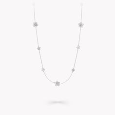 Unmistakably individual, whether worn luxuriously long or doubled up, our diamond sautoir necklace captures the joyful irreverence of the Wild Flower collection. Three different styles of diamond flower blossom with a unique beauty along the delicate white gold chain, inviting you to wear our Wild Flower necklace your way. Escape into a garden that grows just for you with our Wild Flower fine jewellery collection. From trios and individual blooms to floral clusters and blossoms laid out in a row Large Diamond Stud Earrings, Diamond Necklace Tiffany, Large Diamond Rings, Flower Diamond Ring, Pave Diamond Earrings, White Gold Chain, Flower Collection, Pearl Jewelry Necklace, Platinum Jewelry