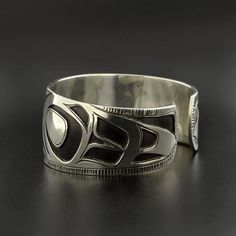 Northwest Coast Overlay Eagle Cuff Bracelet Sterling Silver | Etsy Symbolic Stamped Cuff Bangle Bracelet, Symbolic Stamped Cuff Bracelet, Symbolic Engraved Cuff Bangle Bracelet, Unique Adjustable Cuff Bracelet With Polished Finish, Unique Polished Cuff Jewelry, Symbolic Round Adjustable Cuff Bracelet, Unique Wide Band Formal Bracelet, Unique Bangle With Polished Finish, Unique Wide Band Bracelets For Formal Occasions