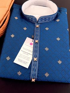 Soft and Premium quality Soft Silk Kurta Pajama in Peacock Blue color Small zari Butti Weaving with self design embroidery material. Item : Men's Kurta PajamaReady to Wear : YesKurta Color : Peacock Blue Pajama Color : GoldFabric : Soft Silk (Non-Prue) Pocket : YesLining (Yes/No) : No Disclaimer-For sizing please refer to the Size Chart given in the listing with the pictures. - Please do NOT go by the size of the Kurta that you already have from another maker. All makers have different size Char Traditional Indigo Kurta With Pallu, Blue Kurta With Traditional Patterns For Ceremonies, Traditional Indigo Sets For Festivals, Transitional Blue Kurta For Traditional Ceremonies, Traditional Blue Sherwani For Diwali, Ceremonial Blue Kurta With Chikankari Embroidery, Blue Embroidered Art Silk Kurta, Blue Ceremonial Kurta For Festivals, Ceremonial Blue Kurta For Festivals