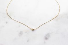 "Classic, minimalist, trendy, dainty, layering necklace for everyday use. MATERIALS: Metal: 14k Goldfill Stone: Freshwater Pearl DETAILS: Chain Type: Cable Pearl Dimension: 5 - 8 mm (approximate) Available Lengths: 14\"-15\", 15\", 15\"-16\", 16\", 16\"- 17\", 17\"- 18\", 18\". Please take note that stones and pearls are naturally imperfect. Also, fine gold filled chains are just like fine real gold chains that are delicate. ----------------------------------------------------------------------- Minimalist Everyday Pearl Necklace With 14k Gold Filled, Delicate Everyday Pearl Necklace In 14k Gold, Minimalist 14k Gold-filled Pearl Necklace For Everyday, Delicate Everyday 14k Gold Pearl Necklace, Dainty 14k Gold Pearl Necklace, Everyday Minimalist Pearl Necklace In 14k Gold, Everyday Minimalist 14k Gold-filled Pearl Necklace, Minimalist Everyday 14k Gold Filled Pearl Necklace, Everyday 14k Gold Pearl Necklace