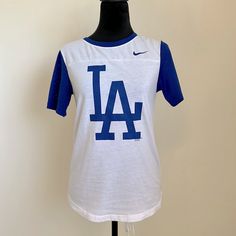 Women Size S Nike La Dodger’s Nike Shirt Brand New Spring Varsity T-shirt With Graphic Print, White Nike T-shirt For Game Day, White Varsity T-shirt With Screen Print, Collegiate Nike Cotton Tops, Nike Varsity Tops For Game Day, Nike Graphic Print Tops For College, Nike Short Sleeve Tops For College, Nike Crew Neck Tops For College, Varsity Style Short Sleeve Tops With Screen Print