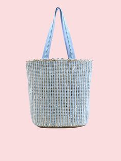 Feeling blue never looked so good! America & Beyond - Natural Beauty Upcycled Hand-Woven Light Blue Tote is here to add a splash of eco-friendly fun to your life. This multi-purpose tote, crafted from hand-weaving fabric with a lurex, is perfect for any adventure. With double shoulder straps adorned with lace details and a playful pom pom tassel charm, it's super stylish & so easy to carry. Inside, you'll find a hanging zip pocket for your essentials and a magnetic button closure to keep everyth Blue Bucket Bag For Daily Use In Spring, Blue Rectangular Bucket Bag For Spring, Blue Spring Bucket Bag, Blue Bucket Bag For Spring, Casual Blue Bucket Bag, Blue Handwoven Summer Beach Bag, Eco-friendly Blue Straw Bag For Beach Season, Blue Bucket Bag With Braided Handles For Travel, Casual Blue Handwoven Straw Bag