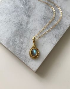 ✦ MATERIALS Pendant: Labradorite / 14k Gold Filled Chain: 14k Gold Filled ✦ SIZE Pendant: Approximately 1/2 inch tall/wide ✦ What is Gold Filled? Unlike gold plated items which have a negligible amount of gold content, gold filled contains a minimum of 5% (1/20) gold by weight pressure bonded over brass. They are tarnish resistant and perfect for those with allergies or sensitive skin. Gold-filled jewelry has 100x more gold alloy than gold plated and because that layer is so much thicker, it mea Gold Oval Pendant Necklace In Labradorite, Gold Labradorite Oval Pendant Necklace, Elegant Gold Necklace With Labradorite, Elegant Labradorite Necklaces With Birthstone, Elegant Gold Labradorite Necklace, Gold Oval Labradorite Necklaces, Gold Oval Labradorite Necklace, Gold Labradorite Gemstone Necklace, Oval Gold Labradorite Necklace