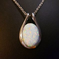 Wonderful White Fire Opal, Large 13x18mm Lab Created Opal, Sleek Design 925 Sterling Silver Pendant With Encorporated Loop Bail And Sterling Chain. Chain Length Options Available, Message Seller At Purchase. Great Gift! Gift Box Included. *See Listing For Black Opal Also Same Setting White Oval Necklace With Polished Finish, White Oval Pendant Jewelry Stamped 925, Silver Oval Necklace With Bail, Oval White Necklace Stamped 925, Fire Opal Necklace, Rainbow Fire, Opal Necklace, Black Opal, Sterling Silver Pendant