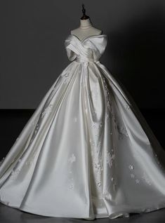 a white wedding dress on a mannequin