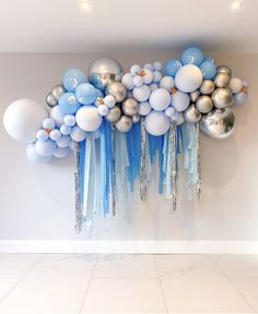 balloons and streamers are hanging on the wall