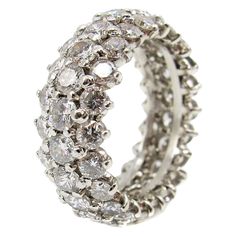 This extremely well handcrafted platinum diamond eternity band is set with 66 bright, white and sparkly round brilliant cut diamonds. The diamonds are all perfectly matched in color, cut and clarity. The average color of the diamonds is approximately E-F , with a clarity of VVS-VS.The total diamond weight is estimated Pearl Engagement Ring Set, Rings Multiple, Tiffany Wedding Rings, Contemporary Wedding Rings, Eternity Band Set, Platinum Diamond Wedding Band, Pearl Engagement Ring, Princess Cut Engagement Rings, White Diamond Ring