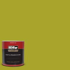 a can of behr paint on an orange background