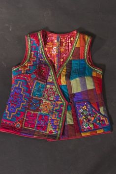 a multicolored patchwork vest on a black background