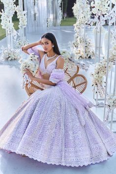 This lehenga set features pearl, sequin & crystal embroidery on a lavender net base. The skirt is paired with fully embellished blouse with dual strings at the back and a matching scalloped net dupatta.From Seema Gujral's Tuscan Summer collection. DELIVERY TIMEPlease allow 8-12 weeks for your outfit to arrive. FABRIC DETAILSNet Professional cleaning only. Luxury Organza Lehenga With Sequins, Luxury Light Blue Floor-length Lehenga, Light Purple Indian Wedding Dress, Luxury Purple Lehenga With Floral Embroidery, Luxury Organza Lehenga For Wedding, Luxury Bollywood Style Light Blue Choli, Luxury Light Blue Choli For Party, Luxury Light Blue Lehenga, Luxury Light Blue Choli With Dupatta