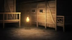 a dark room with two wooden benches and a light on the floor next to it