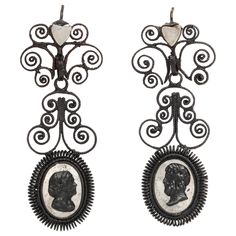 Happy Birthday to these fabulous earrings that are 200 years old this year. Berlin Iron jewelry in excellent condition is rare, even in the museums of the world. The earrings are in three sections, the top two being frilly fine spirals of iron with a silver heart at top. The bottom section is a classical portrait , both male and female on a background of shining steel. The figures would have been recognized in 1820. These are made in Gleiwitz, Germany. By now I have written much about Berlin Iro Gothic Regency, Antique Diamond Earrings, Diamond Chandelier Earrings, Diamond Chandelier, Iron Jewelry, Iron Chandelier, Silver Chandelier Earrings, Georgian Jewelry, Silver Chandelier