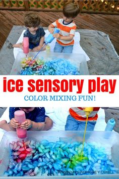 two boys are playing with ice and water in an outdoor play area that is made out of plastic cups