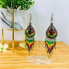 Rastafarian Style with Red, Green and Yellow colors.Handmade cotton thread and beaded earrings, traditional Jamaican colors are woven in geometric patterns to create these Rasta Earrings.Extremely lightweight for all day wear. Jamaican Colors, Pan Africanism, Sanya, Cotton Thread, Jamaica, Beaded Earrings, Dream Catcher, Geometric Pattern, Drop Earrings