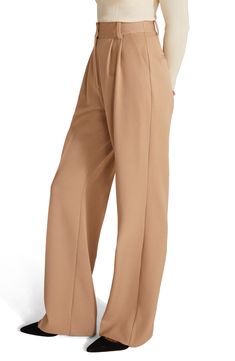 Carefully tucked pleats accent polished workday pants punctuated with elongating front seams and wide legs. 33" inseam; 22" leg opening; 13 1/2" front rise; 17" back rise (size 8) Zip fly with hook-and-bar closure Front slant pockets; back welt pockets 63% polyester, 32% rayon, 5% spandex Machine wash, tumble dry Imported Elegant Office Pants With Pull-on Style, Business Casual Wide-leg Pleated Pants, Fall Wide Leg Dress Pants With Pressed Crease, Elegant Wide Leg Pull-on Pants For Work, Loosely Fitted Trousers With Pleated Waist, Trousers With Pleated Waist And Loosely Fitted Hips, Wide Leg Bottoms With Pressed Crease For Fall, Fall Workwear Bottoms With Pleated Waist, Fall Wide Leg Pants With Pressed Crease