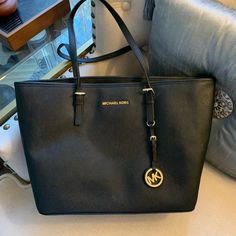 Nwt! Michael Kors Jet Set Tote Black Zip Top Saffiano Medium Bag Leather $298. Michael Kors Jet Set Travel Top Zip Tote In Black Saffiano Leather. Zip Top Closure And Interior Zipper Pocket, Slip Pockets, And Key Holder. Gold-Tone Signature Logo Hardware And Hanging Mk Medallion. Flat Bottom. Dual Adjustable Buckle Shoulder Straps. Bottom Width: 13 Inches; Depth: 6 Inches ; Height: 11 Inches; Strap Length: 22 Inches ; Strap Drop: 11 Inches; Elegant Business Bags With Logo, Classic Michael Kors Shoulder Bag With Logo, Michael Kors Saffiano Leather Shoulder Bag For Shopping, Luxury Michael Kors Bags In Saffiano Leather, Michael Kors Black Saffiano Leather Bag, Black Saffiano Leather Shopping Bags, Formal Michael Kors Saffiano Leather Shoulder Bag, Michael Kors Saffiano Leather Shoulder Bag With Gold-tone Hardware, Everyday Michael Kors Saffiano Leather Bag