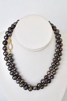 An elegant, family heirloom necklace with black Tahitian pearls. Wear it with cream colors and metallics, or layer it over black for a demure elegance. Materials- 9-11 mm near-round, black Tahitian pearls, gold plated rhinestone lobster clasp, silk thread SizeLength: 37" This listing is for this exact piece. It was lovingly handmade by me in my Florida home studio and is ready to ship. Black Tahitian Pearls, Heirloom Necklace, Tahitian Pearl Necklace, Tahitian Black Pearls, Tahitian Pearls, Family Heirloom, Silk Thread, Cream Color, Lobster Clasp