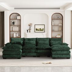 a living room with a large green couch